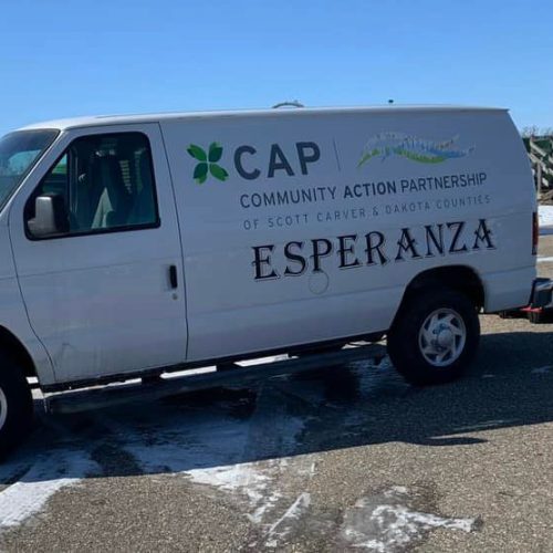 CAP Esperanza van parked at a winter food distribution site.